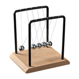 Newton's cradle with metal balls on a wooden base and black frame.