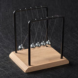 Newton's cradle on a dark textured background
